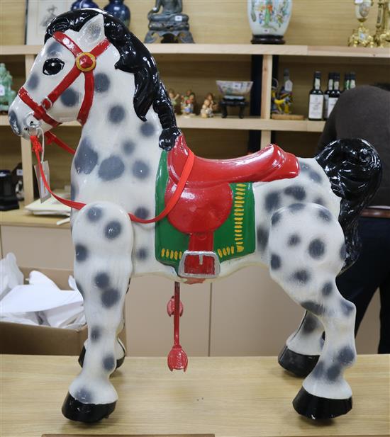 A 1950s Mobo Bronco pressed steel ride-on pedal horse, dapple grey with black main and tail H.76cm.